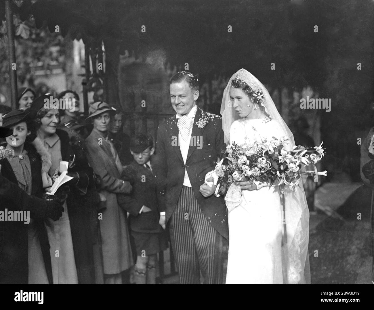 Famous racing driver married to woman fencer at St Clement Danes , London . Mr Clifton Penn Hughes married to Miss Judy Guinness . 12 October 1935 Stock Photo