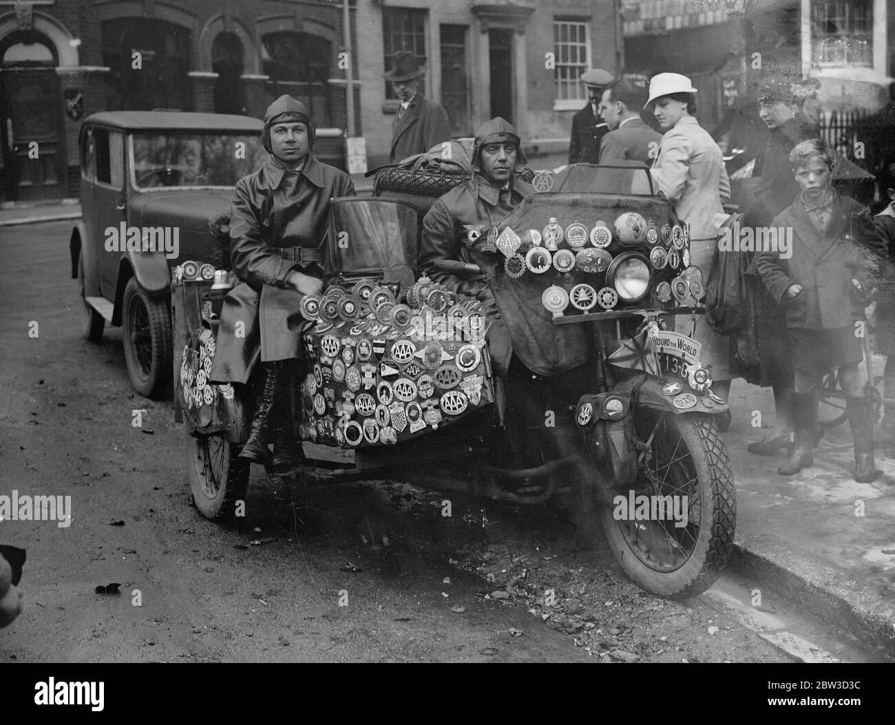 Hungarians at Southampton as they complete world motor cycle tour , 95 , 000 miles in 63 countries . Zoltan Sulkowsky and Gyula Bartha of Budapest , Hungary , arrived at Southampton as they neared the end of what they claim to be the first complete round the world tour by motor cycle . They had covered 95000 miles , passing through 63 countries of Europe , Africa , Asia , Australasia and North and South America . The last three months they have spent covering 4000 miles in the British Isles . Now they are making their way back to Budapest via Belgium , Holland and Germany . Sulkowsky and Barth Stock Photo