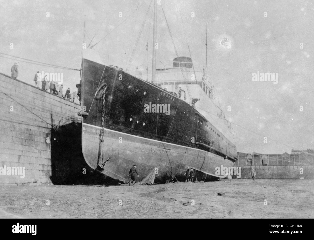 Channel steamer badly holed after striking rock near Jersey . Limps back to port . The Lorina in dry dock at Jersey after she had limped back to port . 24 October 1935 Stock Photo