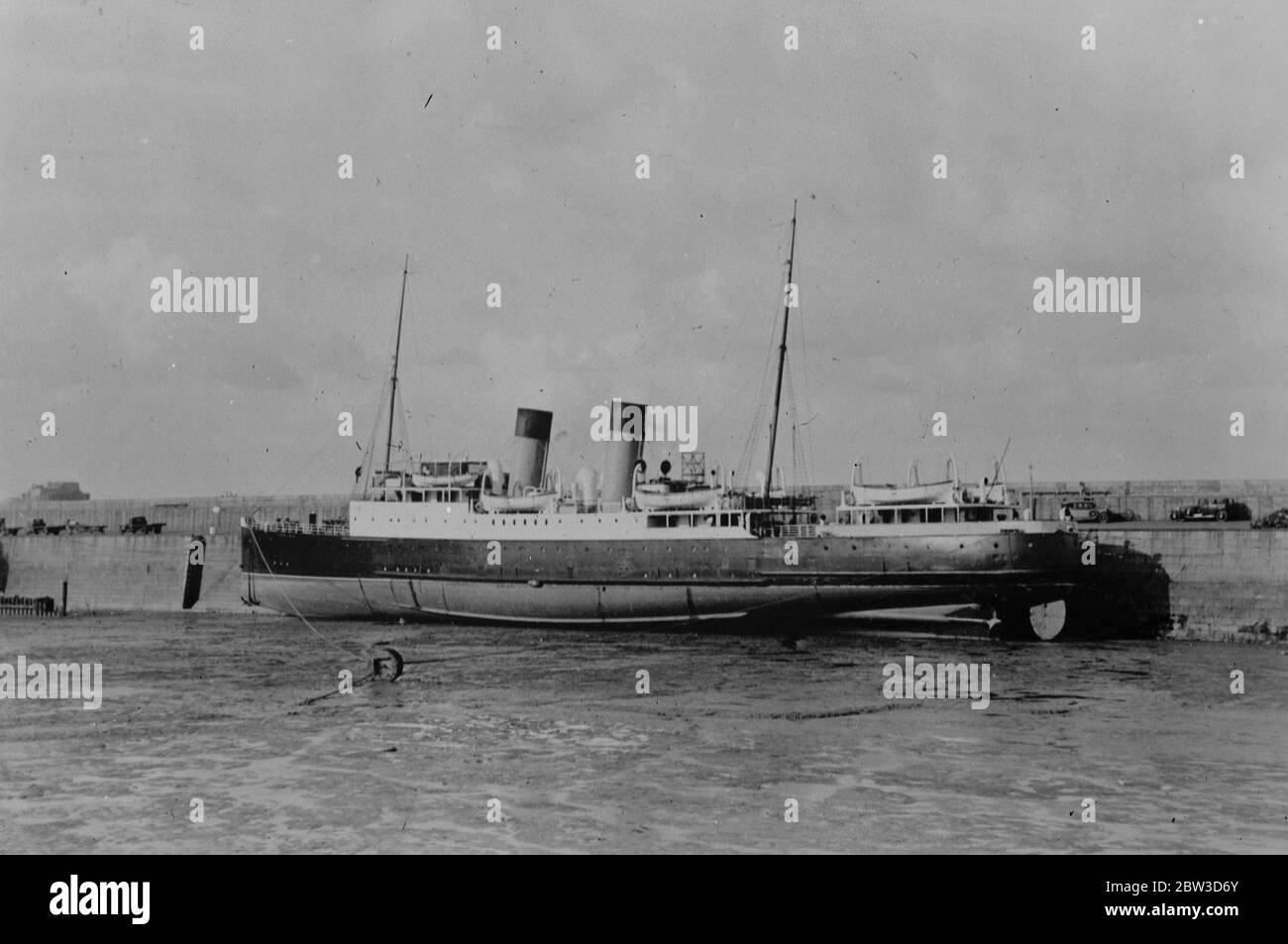 Channel steamer badly holed after striking rock near Jersey . Limps back to port . The Lorina in dry dock at Jersey after she had limped back to port . 24 October 1935 Stock Photo