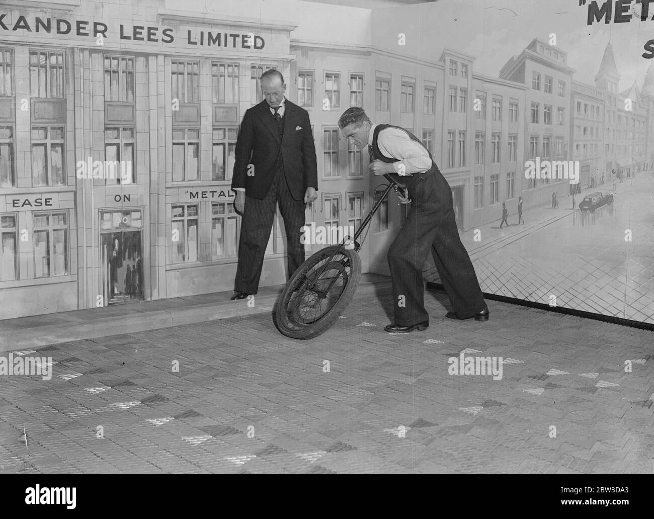 Skidproof metal road surface demonstrated at London exhibition . A new metal road surface being demonstrated . The surface is said to be absolutely skidproof . 18 November 1935 Stock Photo