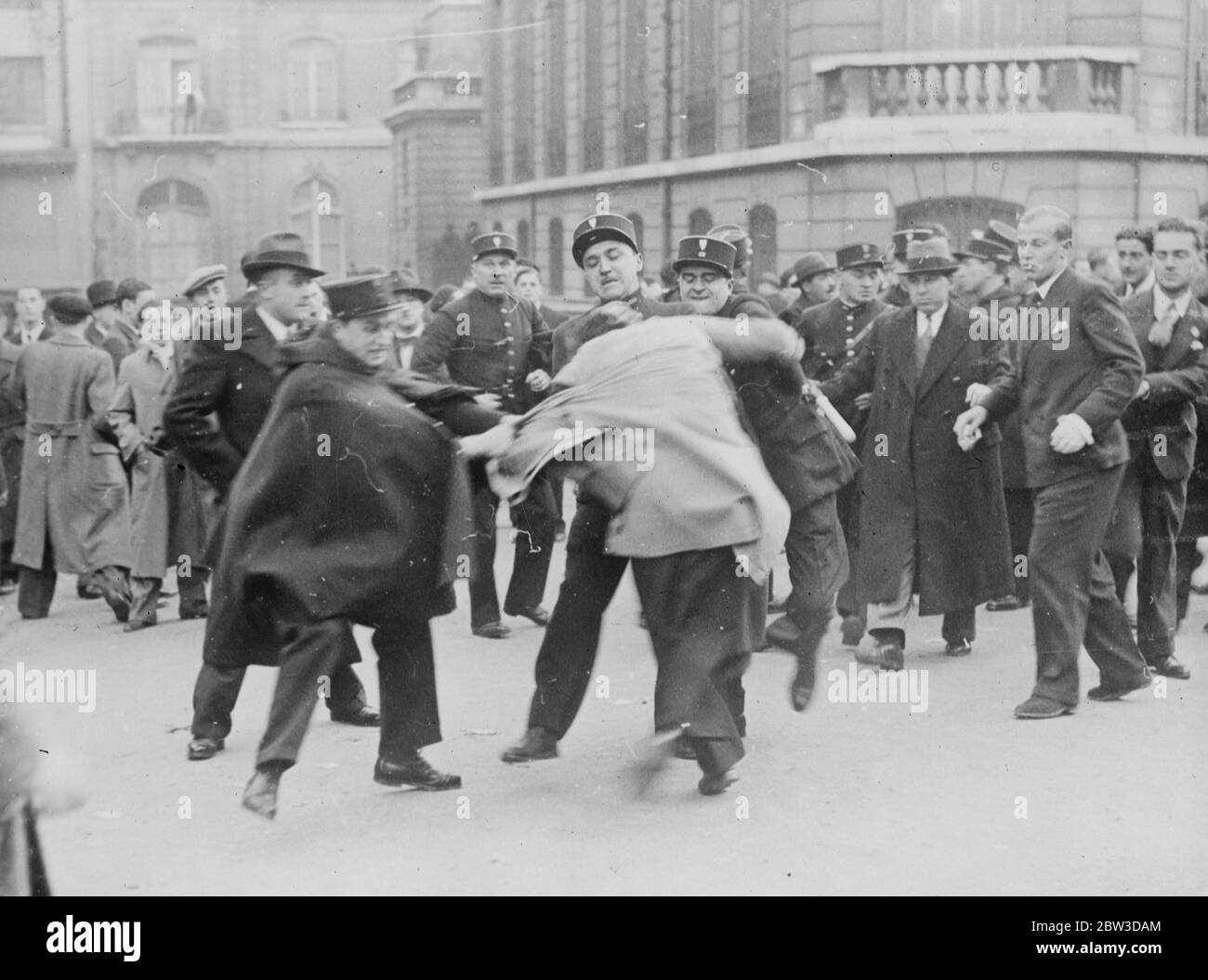 War veteran and right wingers in confrontation in Paris . There were fierce scuffles between demonstrators and police near the Arc de Triomphe in Paris when left wing war veterans came into conflict with right wing organisations marching up the Champs-Élysées during the Armistice celebrations . Many arrests were made and a number of combatants injured . Photo shows police struggling with a demonstrator near the Arc de Triomphe . 12 November 1935 Stock Photo