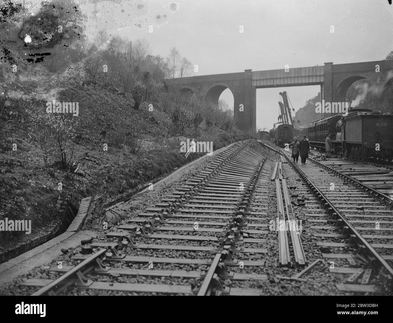 Train wrecked by landslide in Hampshire . Hundreds of tons of earth and