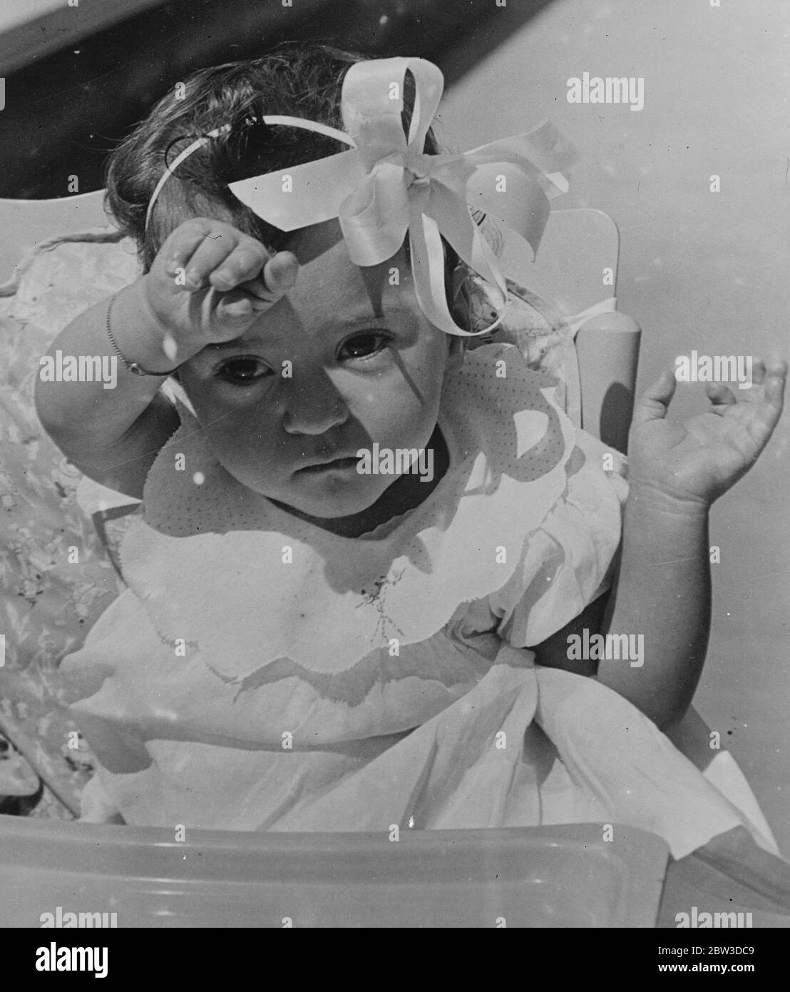 Marie sets a new fashion . With her dainty frock and large becoming bow , gentle Marie sets a new fashion for the famous Dionne quintuplets . 17 November 1935 Stock Photo