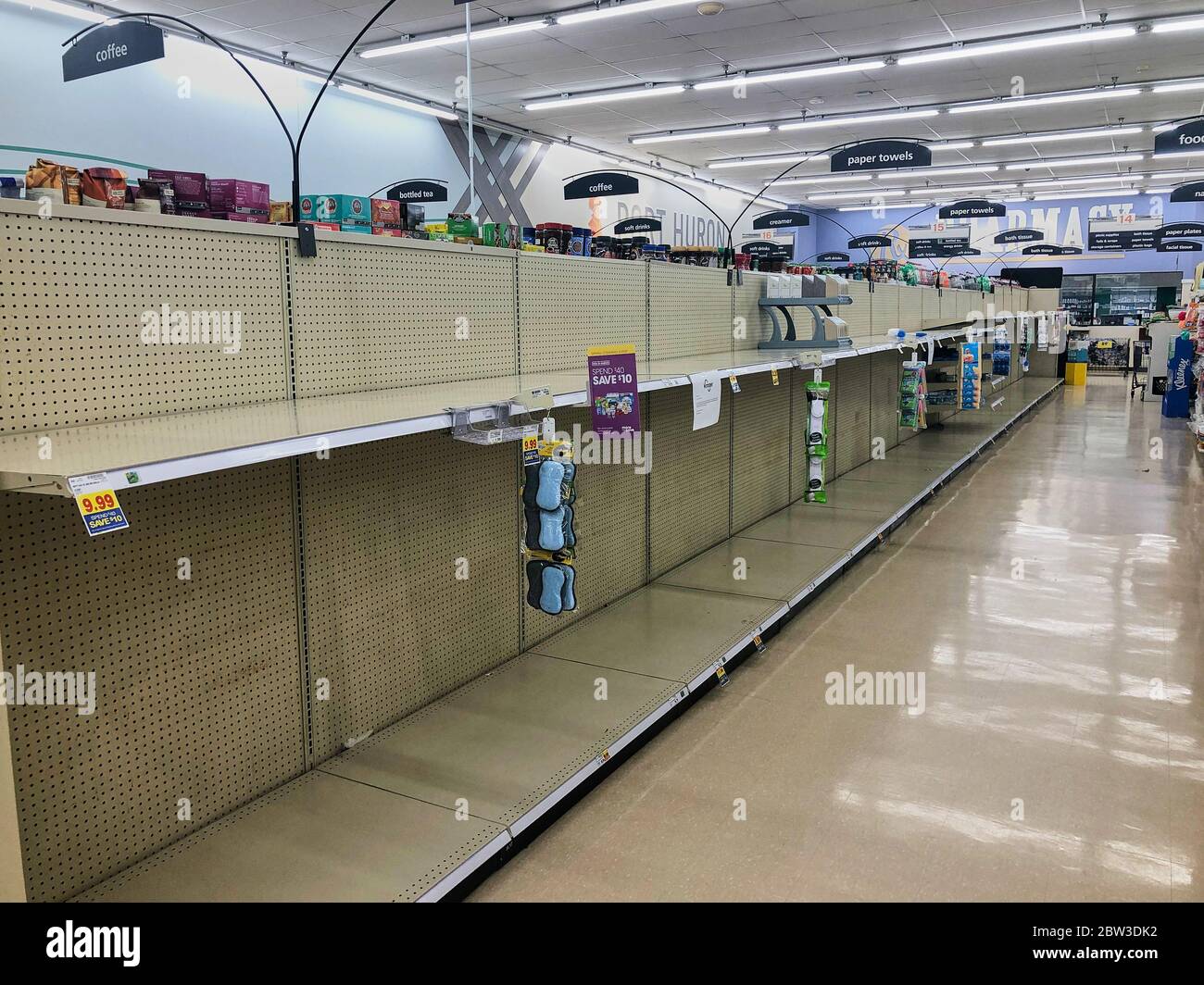 Empty shelves in a grocery store market. Stock Photo