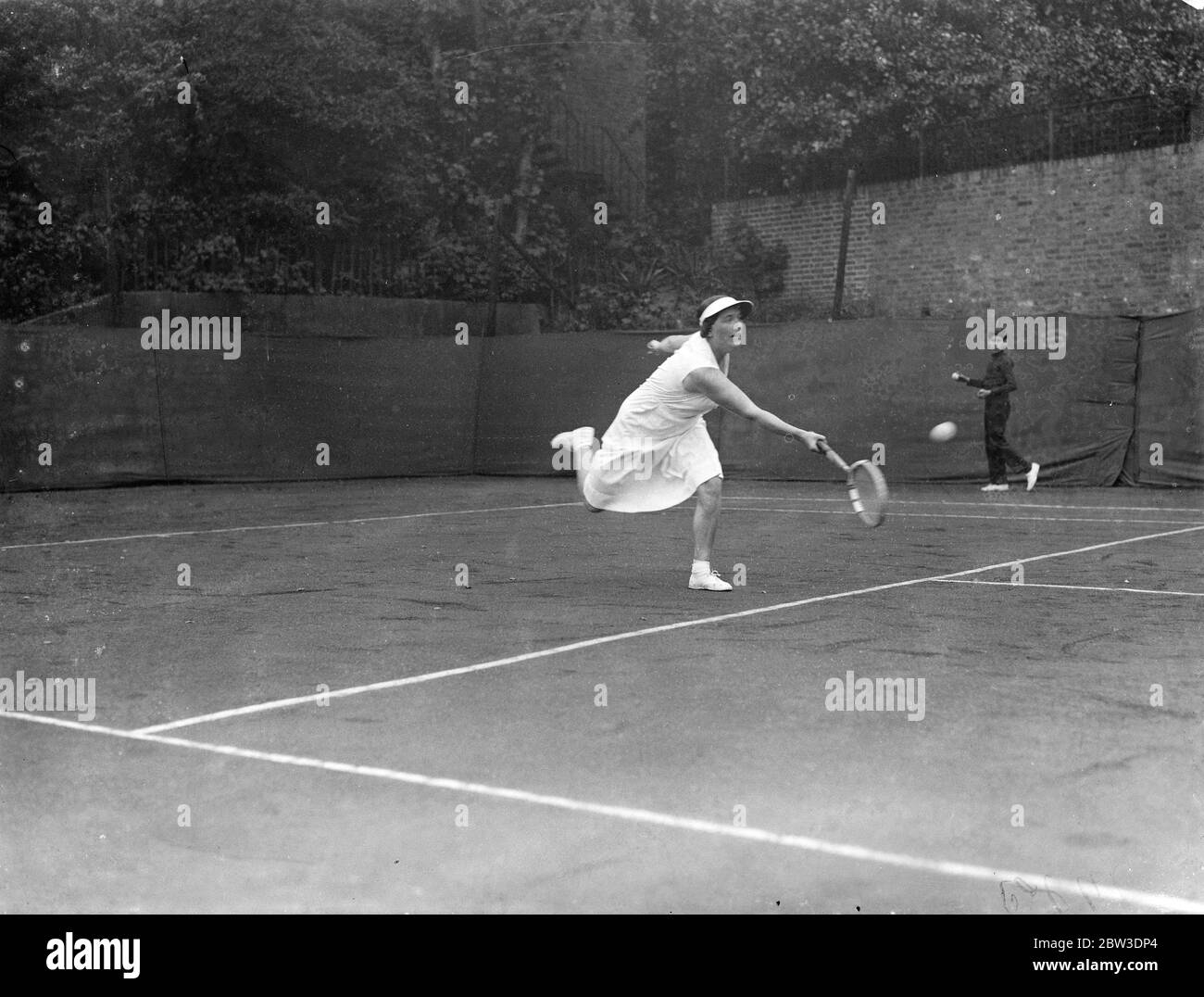 Cumberland Club 's tennis tournament opens . Autumn hard court season . Mrs G A Miles in play . 16 September 1935 Stock Photo