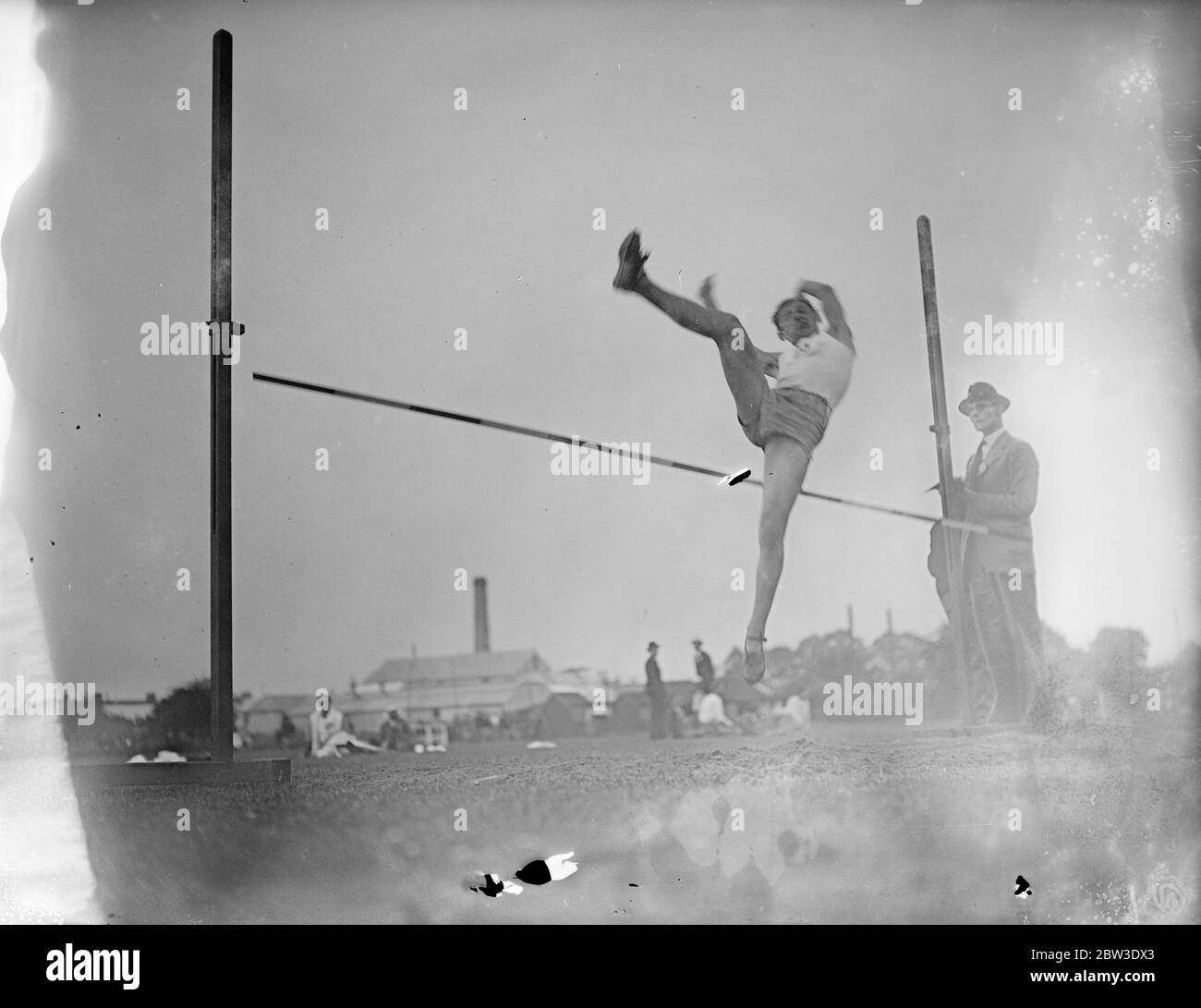 Paris schoolboy athletes meet London team for first time at Rutlish school , Merton , London . Photo shows Andre Perissel performing the high jump . 26 July 1935 Stock Photo