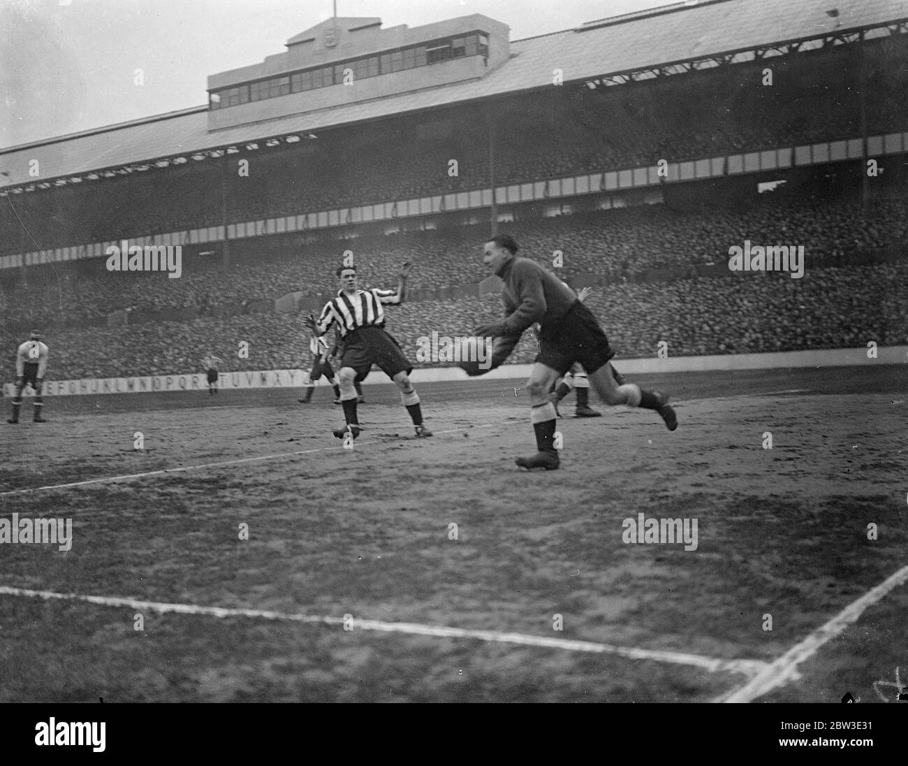 Tottenham Hotspur and Newcastle United met in the fourth round of the F A Cup competition at White Hart lane . Norman Tapken saves a penalty from an unknown Tottenham player . 26 January 1935 Stock Photo