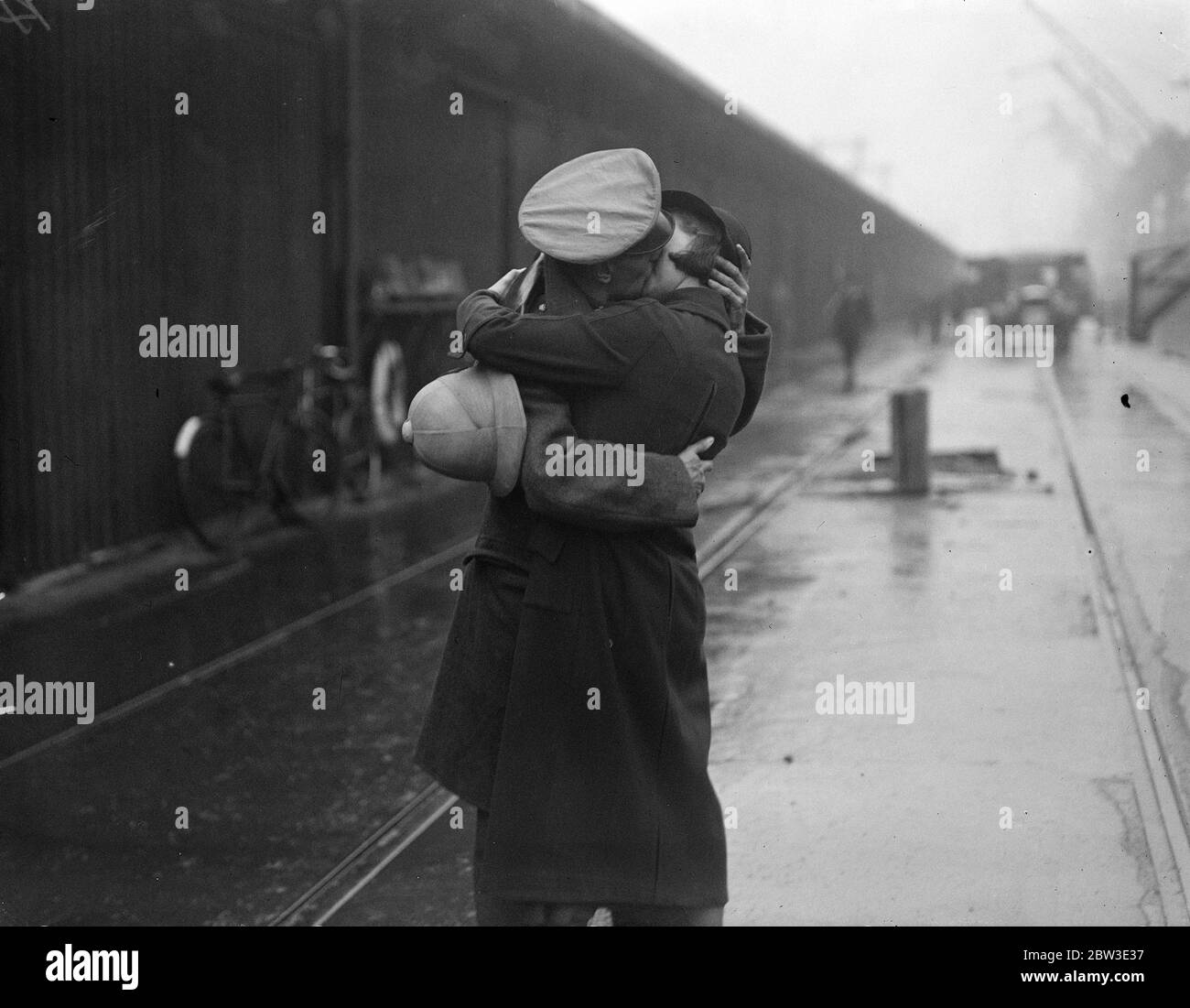 A soldier who has been serving in India being greeted by his wife on arrival at the King George V Dock . 4 December 1934 Stock Photo