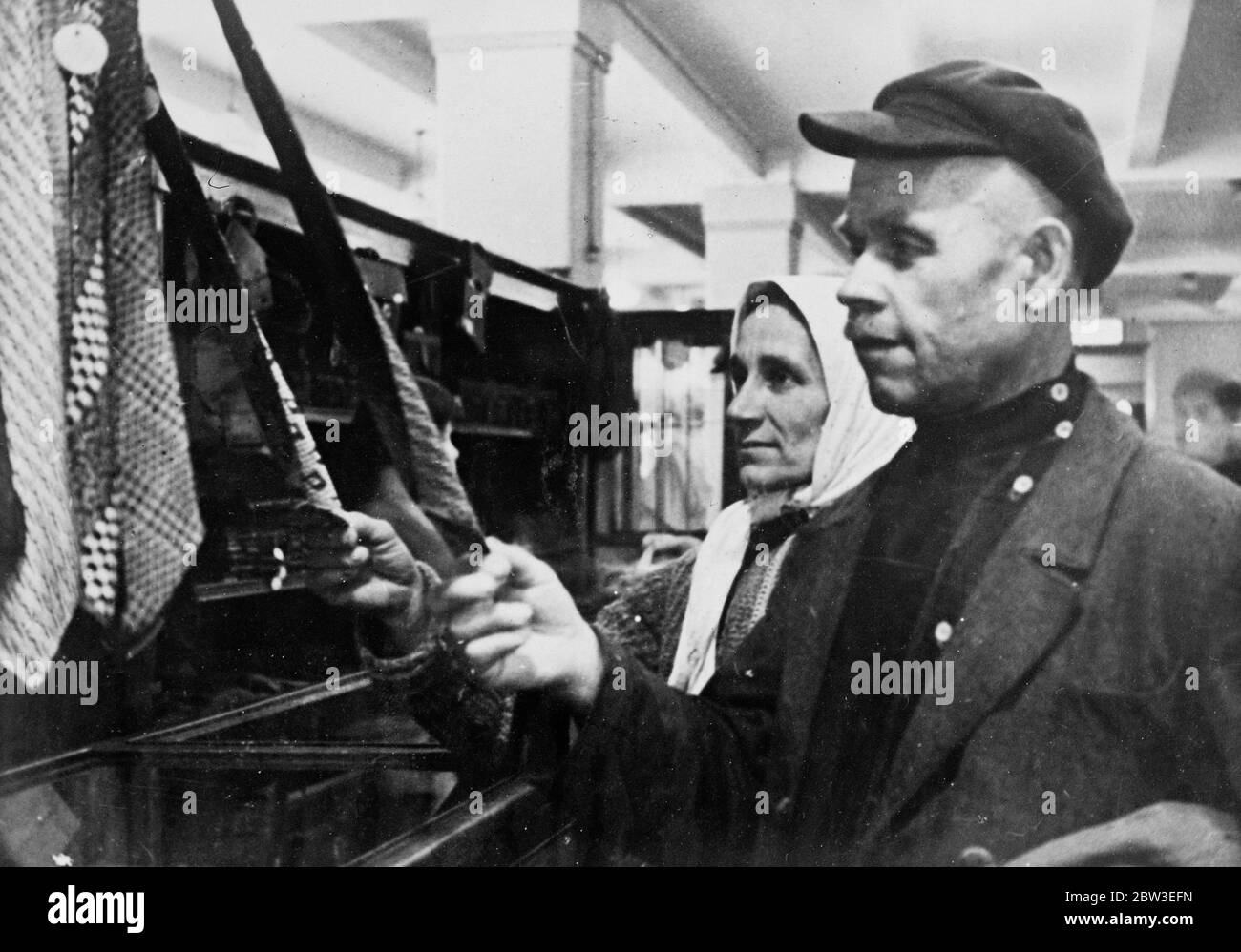 A Russian couple buying ties . 1934 Stock Photo