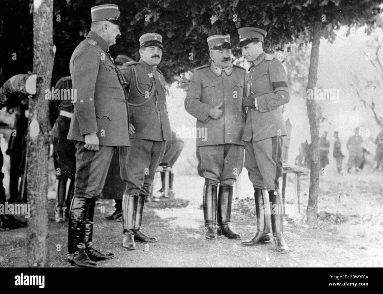 Prince Paul at review of troops in Belgrade . Prince Paul of Jugoslavia was present at a review of troops in Belgrade with M Stoyadinovitch , Jugoslav Premier , on whose life an attempt was recently made by an oppostion deputy in Parliament , and members of M Stoyadinovitch ' s reconstructed Cabinet . Photo shows , Prince Paul ( right ) talking with General Lubomir Meritel , new War Minister, at the review . Second from left is General Petar Tivkovitch . 11 March 1936 Stock Photo