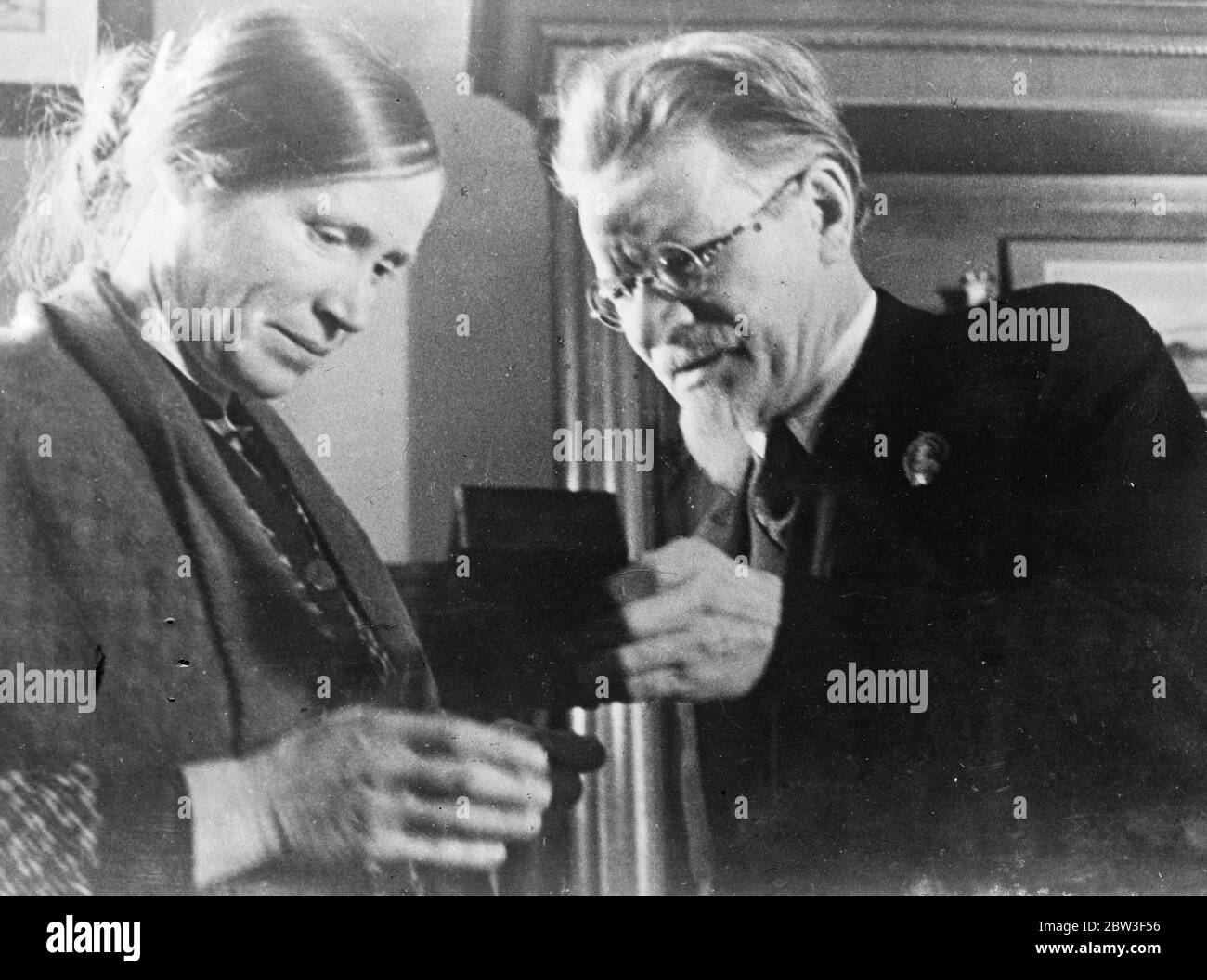 Milkmaid receives Soviet ' s highest award . Supreme award of the Soviet Union , the Order of Lenin was presented to a milkmaid , Olga Akimovas Shalagina by M I Kalinin , President of the Peoples Commissars during the important Agricultural Conference at the Kremlin in Moscow . 1 , 500 agricultural workers from every part of the Union and Government leaders attended the conference to discuss the latest reports and developments . Photo shows , Olga Akimovna Shalagins , milkmaid of the Krasnoyarsk district , receiving the Order of Lenin from M I Kalinin , President of the Peoples Commissars at t Stock Photo