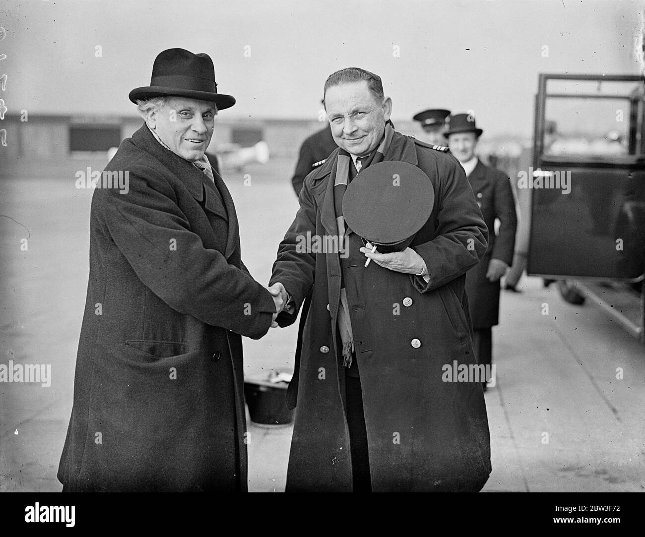 M Paul Boncour arrives at Croydon by air for League Council meeting . M Paul Boncour , French Minister of State , arrived at Croydon by air to attend the meeting of the League Council in St James in St James ' s Palace tomorrow ( Saturday ) when the Rhineland situation will be discussed . Photo shows , M Paul Boncour shaking hands with the pilot after his arrival at Croydon . 13 March 1936 Stock Photo