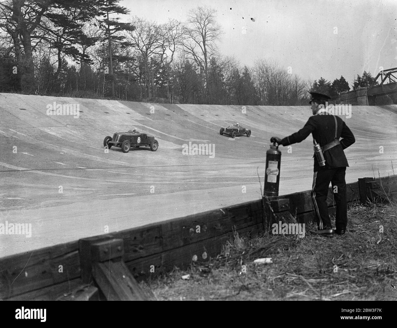Women beats men at first Brooklands meeting . With women racing on equal terms with men for the first time , the first meeting of the new motor racing season was held at Brooklands . An early victory was scored for the women by Miss D Summers , who gained first place in the Second March Short Handicap driving a Mercedez Special . Photo shows , racing over the railway straight . A fireman is in foreground . 14 March 1936 Stock Photo