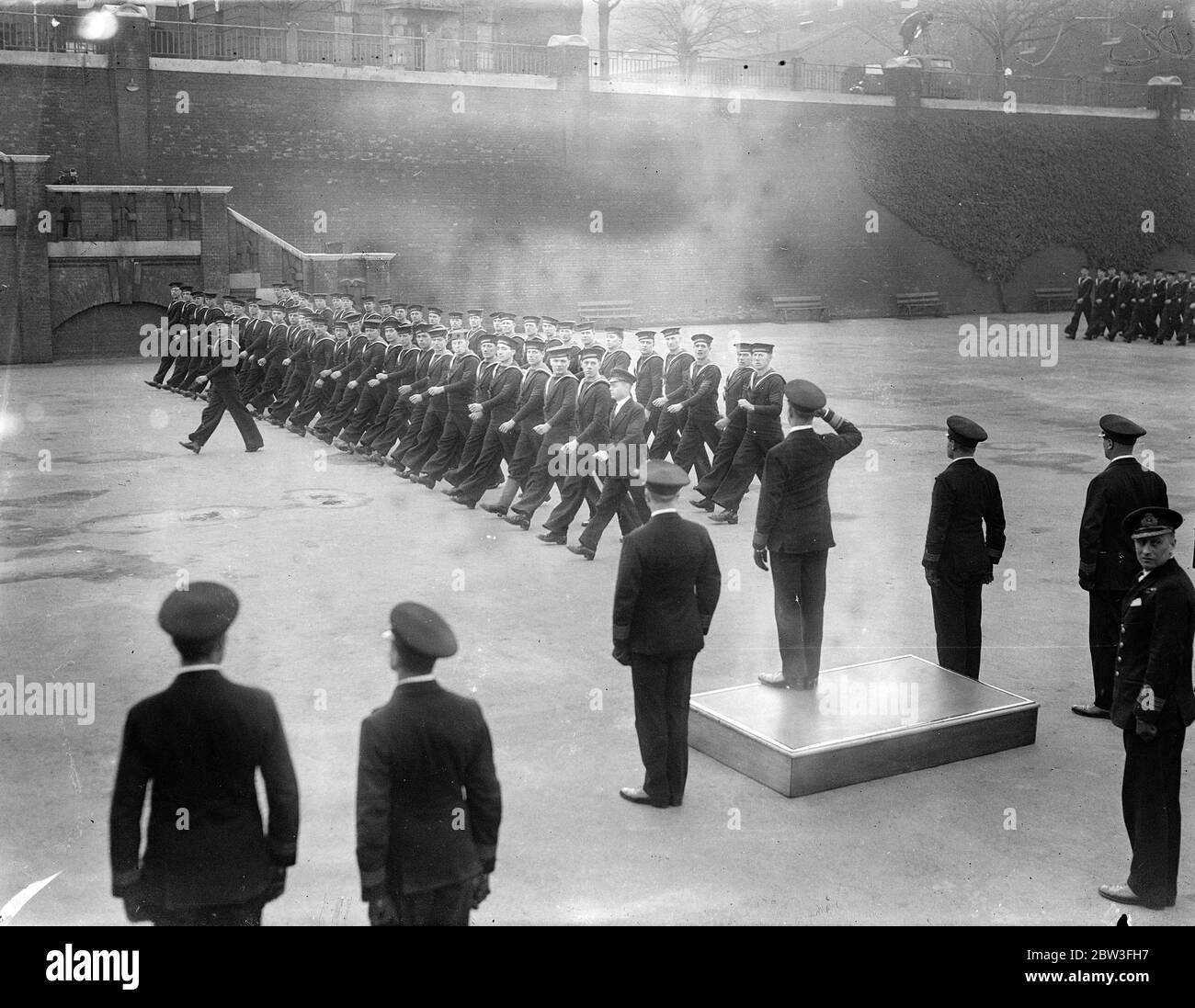 Commodore of Royal Naval barracks says ' goodbye ' at Chatham . Rear Admiral R C Davenport said goodbye at the Royal Naval barracks at Chatham , after two years as Commodore . He made a farewell speech on the parade ground and then took the salute at the march past . 29 January 1935 Stock Photo