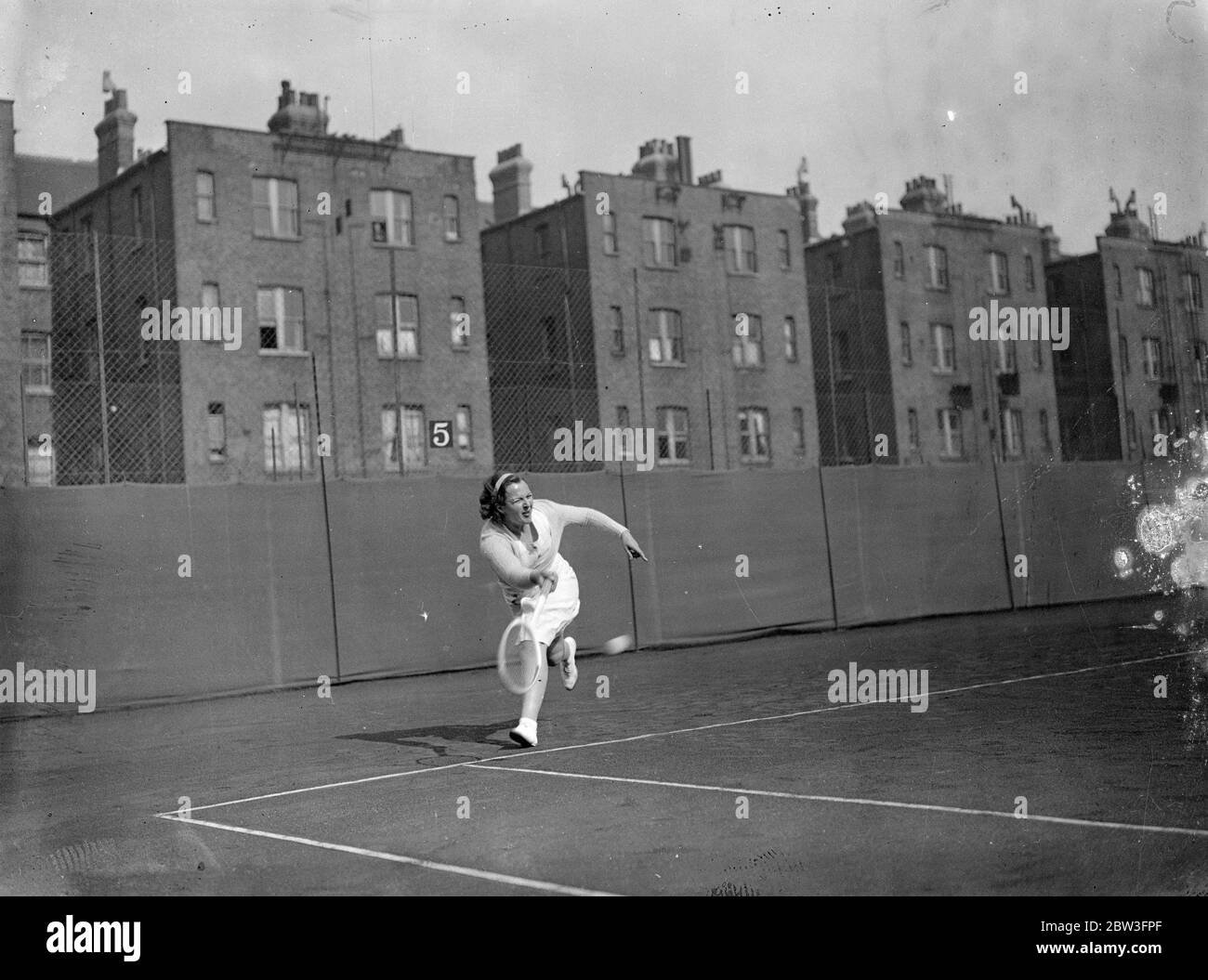 Betty Nuthall , playing in skirt instead of shorts , in action at Paddington . Miss Betty Nuthall in skirt , playing against Mrs List at Paddington , London . 31 March 1935 Stock Photo