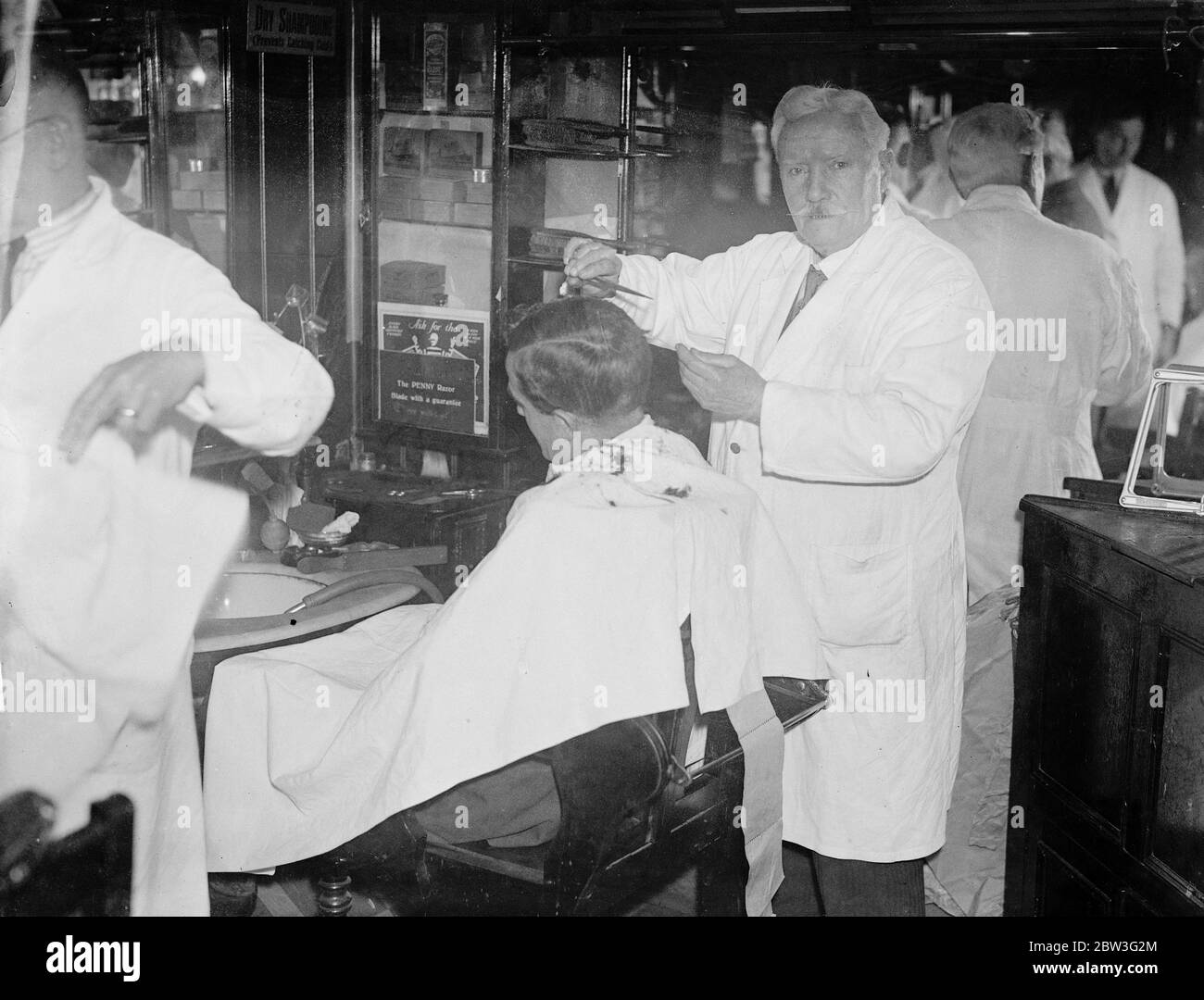 56 years a barber and working as hard as ever , Ludgate Hill barber celebrates his 73 birthday . Mr A J Kingstone , the  happy haircutter  of Ludgate Hill . 7 February 1935 Stock Photo