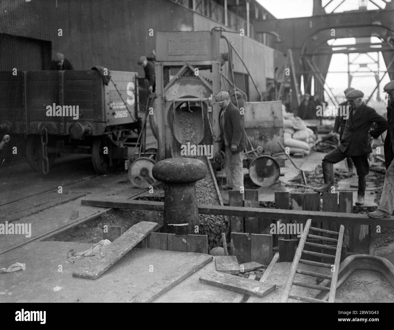 Strengthening ' Queen Mary ' s ' berth at Southampton . The berth which will be used by the giant new liner ' Queen Mary ' at Southampton is being reinforced . Extra strong bollards are being fitted in the quayside . Photo shows fitting the extra strong bollards in the quayside in readiness for the ' Queen Mary ' at Southampton . 6 March 1936 Stock Photo