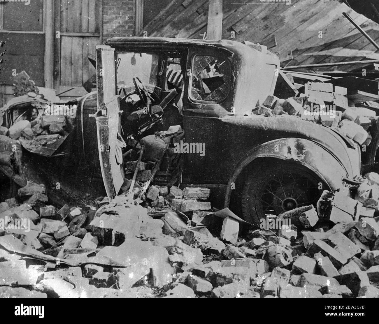 100 miles an hour tornado kills 40 in Southern states . Forty people were killed , many injured and hundreds made homeless by a 100 miles an hour tornado that swept a path of disttruction through the southern states of , Georgia , Alabama , and South Carolina , USA , Buildings torn down by the force of the wind , accounted for many of the deaths . Photo shows , a car smashed to scrap by a shower of bricks from a collapsing building at Greensboro , North Carolina . Eleven were killed in the Carolina town . 10 April 1936 Stock Photo
