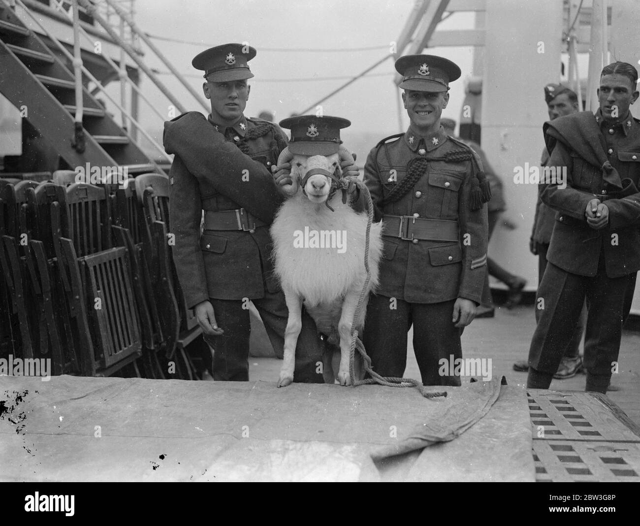 Sherwood Foresters home , with their goat ! . Bringing with them their goat mascot , Derby XV , Sherwood Foresters arrived at Southampton on the troopship Cameronia after service aboard . Photo shows , Sherwood Foresters cheering their mascot at Southampton . 8 April 1936 Stock Photo