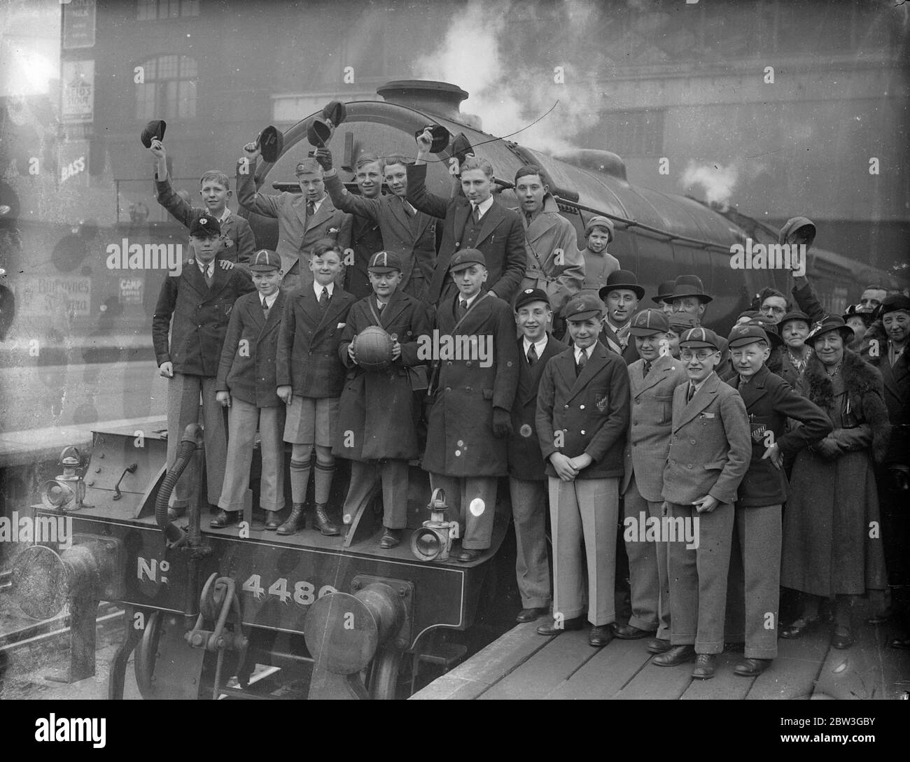 London schoolboys leave for Russia . To meet Finnish boys in football match . The first party of British schoolboys to visit the USSR , twenty boys from from the Barnsbury Central School , Islington , left King ' s Cross Station , London , on their way to Russia . They are to visit Copenhagen and Helsingfora , where they will meet a team of Finnish boys who have taken the name ' Arsenal ' in a football match . The London schoolboys are taking a football autographed by every member of the Arsenal team , and at the end of the match the British Minister in Finland will present the ball to the Fin Stock Photo