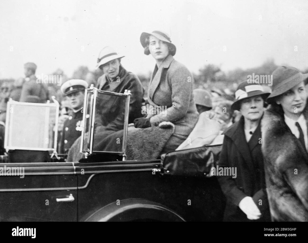 Queen of Denmark and Crown Princess Ingrid watch great military review . Queen Alexandrine and Crown Princess Ingrid watching the review from the back of their car . 4 October 1935 Stock Photo