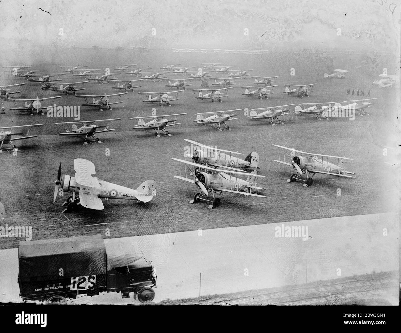 RAF Mildenhall , stands in preparation to welcome King George V, who is to come to the base to conduct the first ever Royal Review of the RAF on July 6, of assembled over 356 of its combat aircraft, and made up of 38 squadrons . Photo shows , some of the aircraft lined up . 2 July 1935 Stock Photo