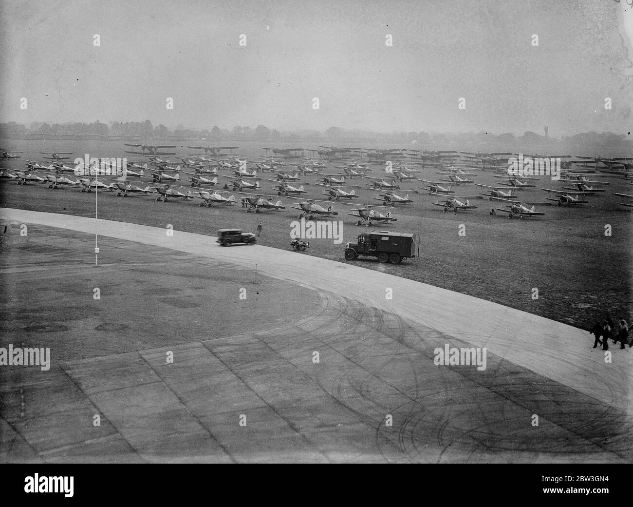 RAF Mildenhall , stands in preparation to welcome King George V, who is to come to the base to conduct the first ever Royal Review of the RAF on July 6, of assembled over 356 of its combat aircraft, and made up of 38 squadrons . Photo shows , some of the aircraft lined up . 2 July 1935 Stock Photo