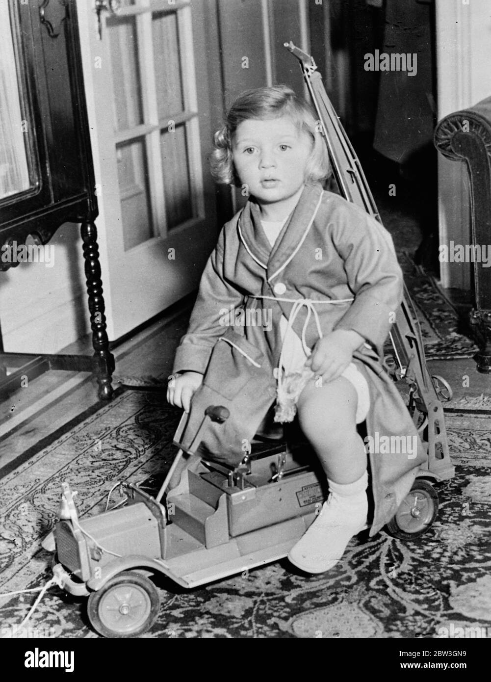 Hauptmann 's baby son is wistful . Little Manfried Hauptmann , small son of Bruno Richard Hauptmann , playing with his toy motor lorry . 31 March 1935 Stock Photo