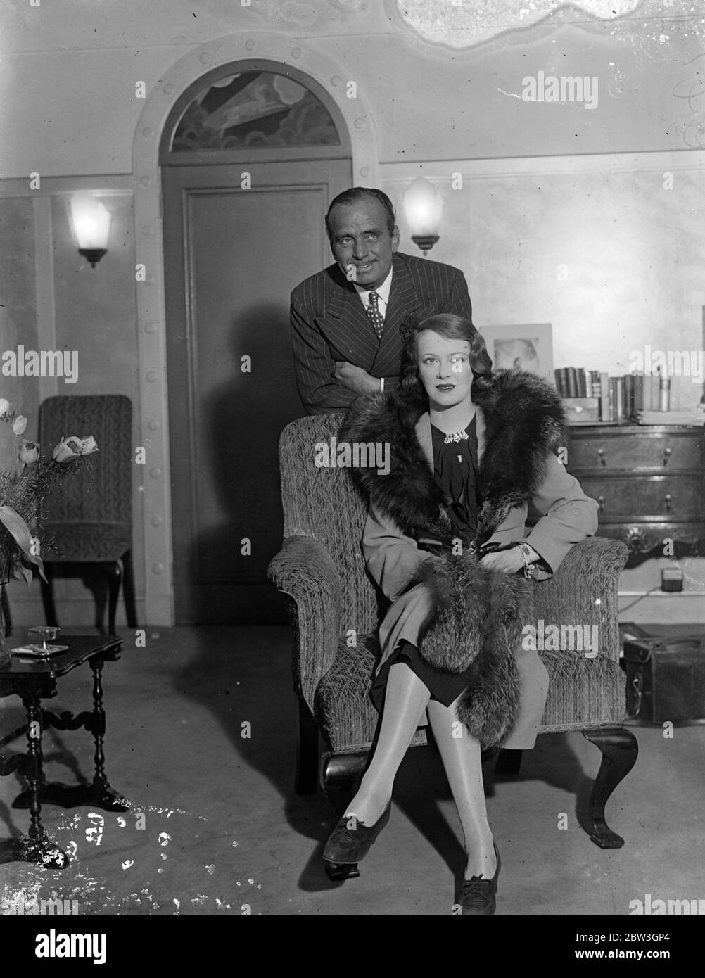 Douglas Fairbanks and his wife return to London after honeymoon . Douglas Fairbanks photographed with his wife at his London hotel . 20 March 1935 Stock Photo