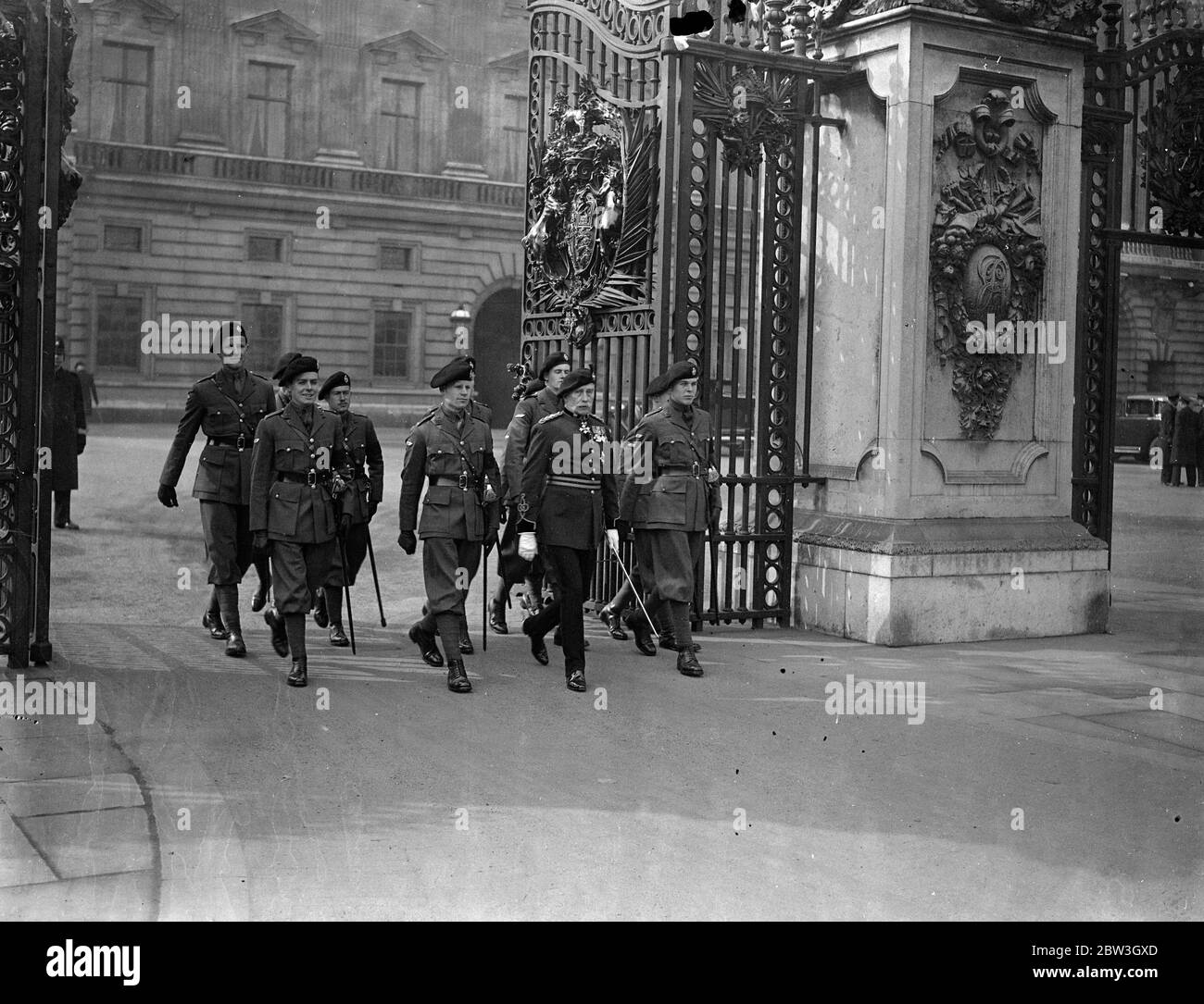 Officers of the Tank Corps , led by Major General Sir Ernest Swinton , leaving Buckingham Palace , yesterday , after attending the first levee held by King Edward . Stock Photo