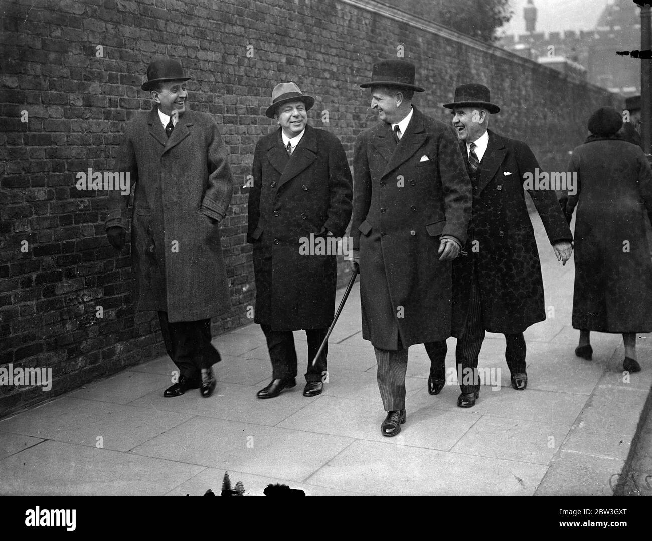 Empire delegates leave after League Council meeting . Delegates left St James Palace after the League Council had met to hear Germany ' s case for the reoccupation of the Rhineland put by Herr von Ribbentrop , chief German delegate . Photo shows , Sir James Parr , High Commissioner for New Newzeland ( extreme right ) and Mr Te Water , High Commissioner for South Africa , ( second from right ) leaving after the meeting . 19 March 1936 Stock Photo
