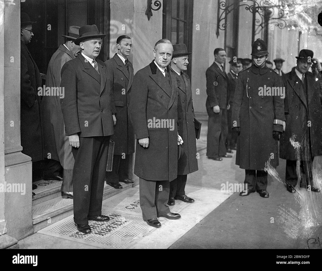 Herr von Ribbentrop goes to League Council meeting . First German representative since 1933 . Herr von Ribbentrop , Herr Hitler ' s Ambassador at large , left his hotel in London to attend first League Council meeting at which Germany has been represented since she left the League in 1933 . Herr von Ribbentrop is taking part in discussions on the reoccupation of the Rhineland . Photo shows , Herr von Ribbentrop leaving his hotel for the League Council meeting . 19 March 1936 Stock Photo