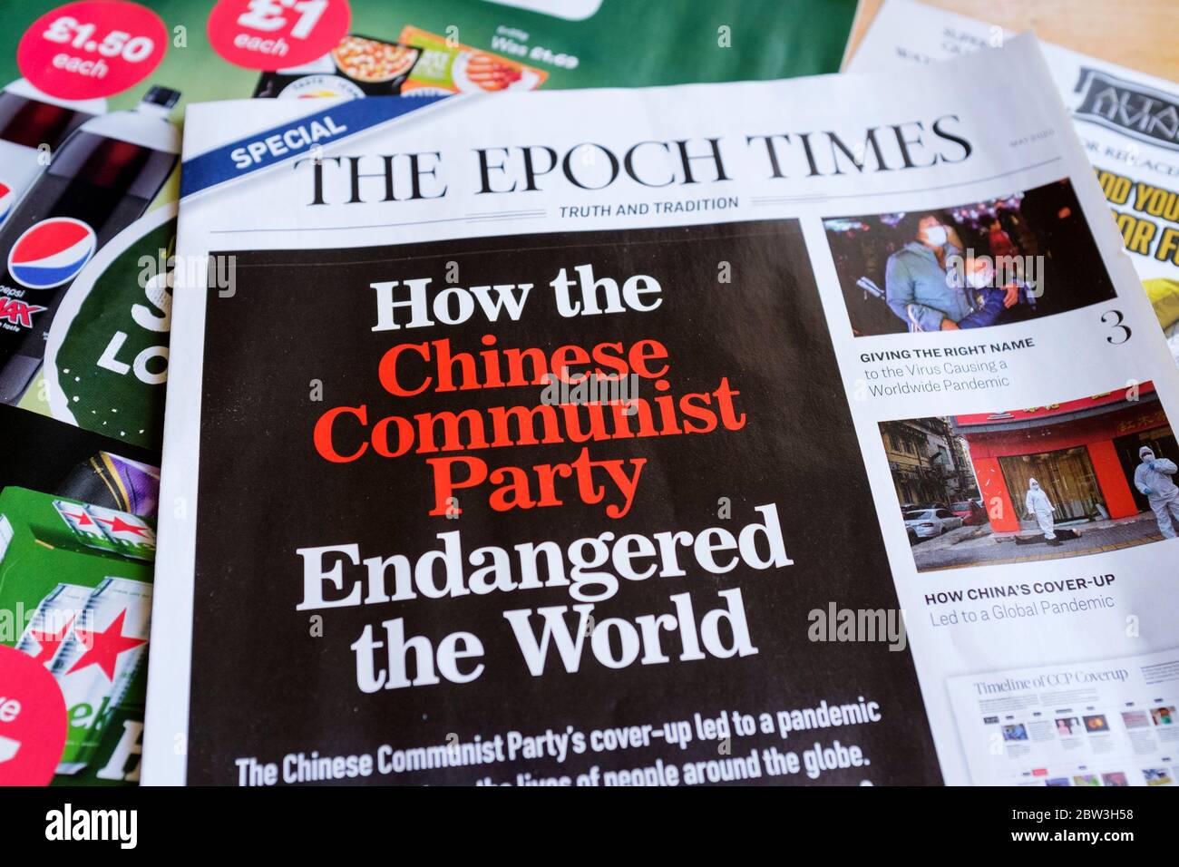 A sample copy of The Epoch Times posted to UK homes with other general unsolicited mail claiming the Chinese Communist Party was responsible for a cover-up over the coronavirus outbreak in Wuhan. Stock Photo