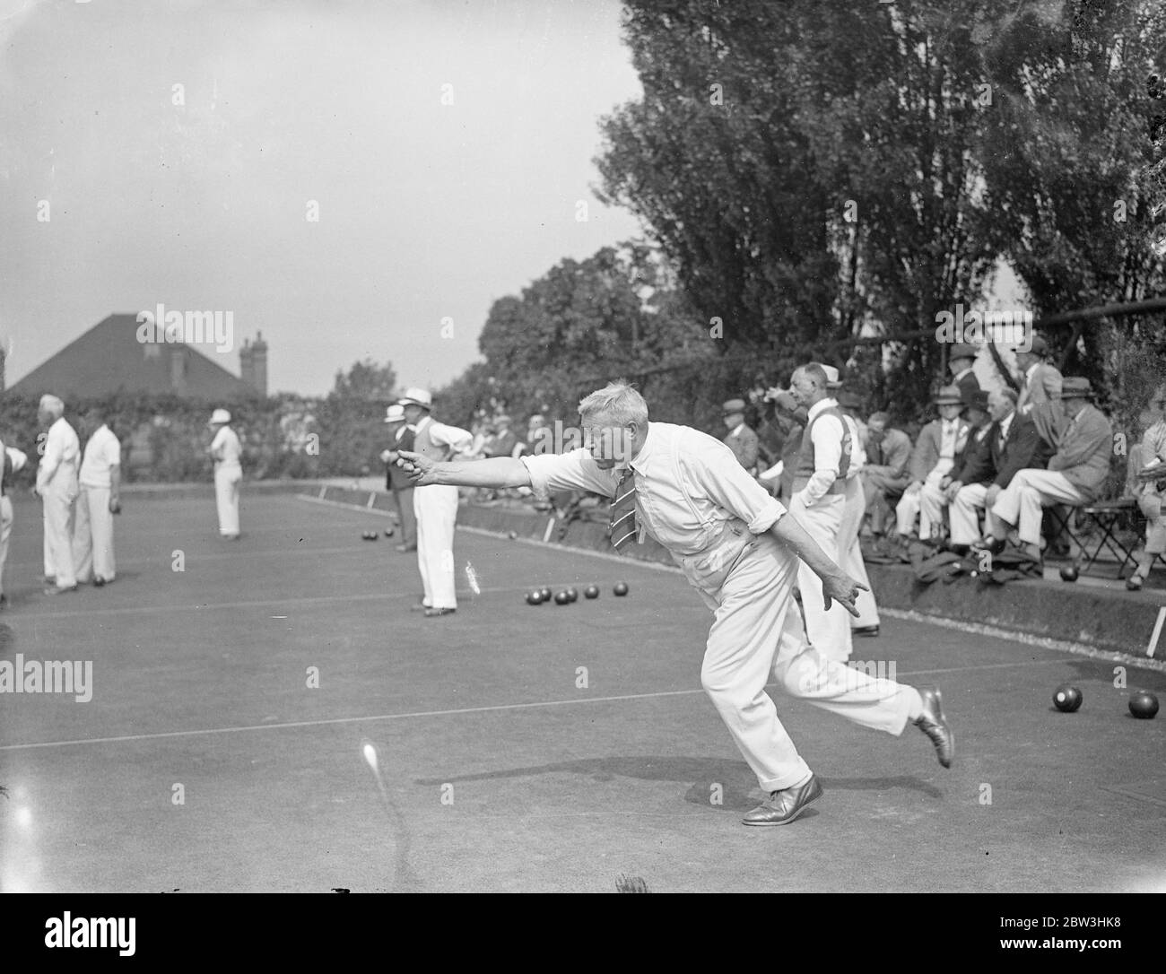 National Amateur Bowling Championships Open In London . The English Bowling Association ' s Amateur National Championships for 1936 have opened at the Temple Bowling Club , Denmark Hill , London . Three hundred and fourteen amateur bowlers - survivors of the qualifying rounds - are competing in the in the 27th championship meeting . Photo shows : Mr . H . Taylor of Faversham in an  action  attitude as he follows his wood when playing against Shirley Park ( Surrey ) . 10 Aug 1936 Stock Photo