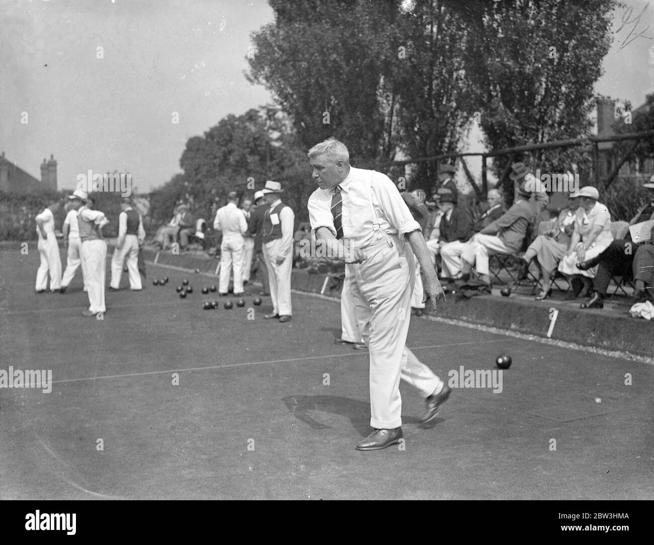 National Amateur Bowling Championships Open In London . The English Bowling Association ' s Amateur National Championships for 1936 have opened at the Temple Bowling Club , Denmark Hill , London . Three hundred and fourteen amateur bowlers - survivors of the qualifying rounds - are competing in the in the 27th championship meeting . Photo shows : Mr . H . Taylor of Faversham bowling a wood playing against Shirley Park ( Surrey ) . 10 Aug 1936 Stock Photo