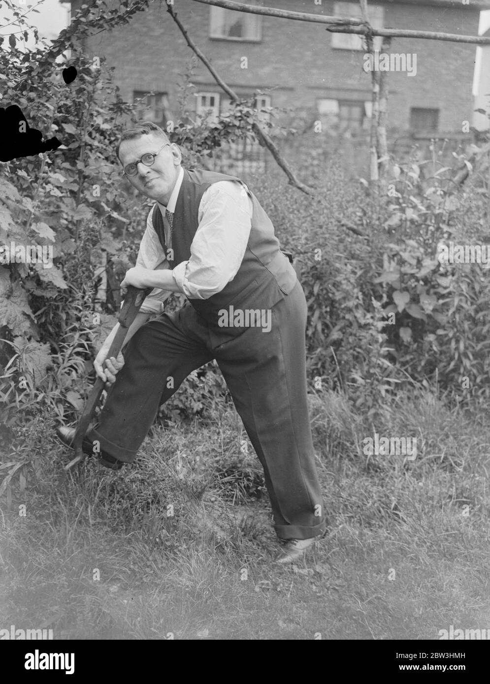 Back in an English Garden . Mr Rohme finds peace at London home after imprisonment in Germany . Tending his garden in the peace of surburban London , Mr Robert O Rohme is now recuperating at his home in Colindale from the effects of his 15 months imprisonment in Germany , where he was accusedof insulting Hitler . Mr Rohme says he ' suffered hell ' at the hands of the Nazi , who subjected him to virtual starvation , and is now attempting to regain the nearly four stones of weight he lost during his imprisonment . Photo shows , Mr Robert O Rohme digging in his garden at Colindale . 13 July 1936 Stock Photo