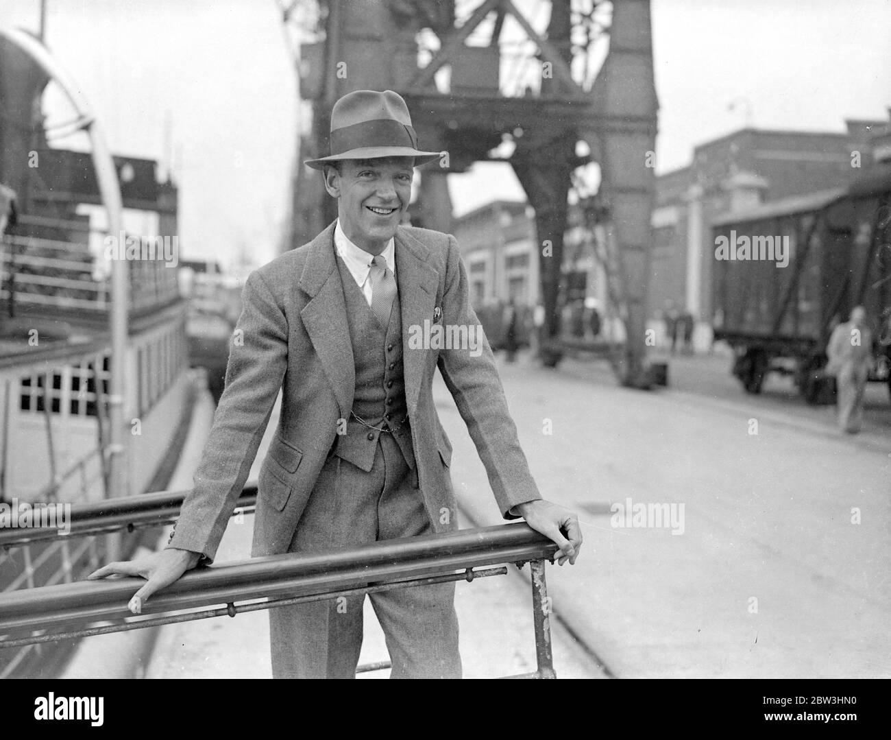 Fred Astaire Arrives In England From America . Fred Astaire , famous film dancing partener of Ginger Rogers , arrived at Southampton on the liner Normandie from America . Astaire ' s sister - formerly Adele Astaire - is Lady Charles Cavendish . Photo shows : Fred Astaire on arrival at Southampton . 10 Aug 1936 Stock Photo