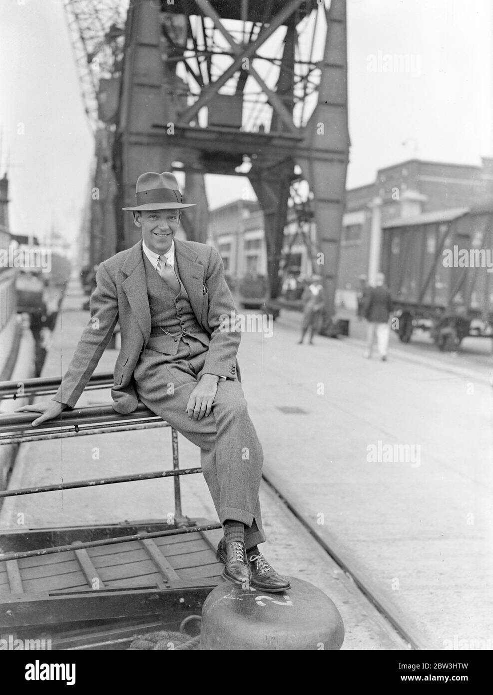 Fred Astaire Arrives In England From America . Fred Astaire , famous film dancing partener of Ginger Rogers , arrived at Southampton on the liner Normandie from America . Astaire ' s sister - formerly Adele Astaire - is Lady Charles Cavendish . Photo shows : Fred Astaire on arrival at Southampton . 10 Aug 1936 Stock Photo