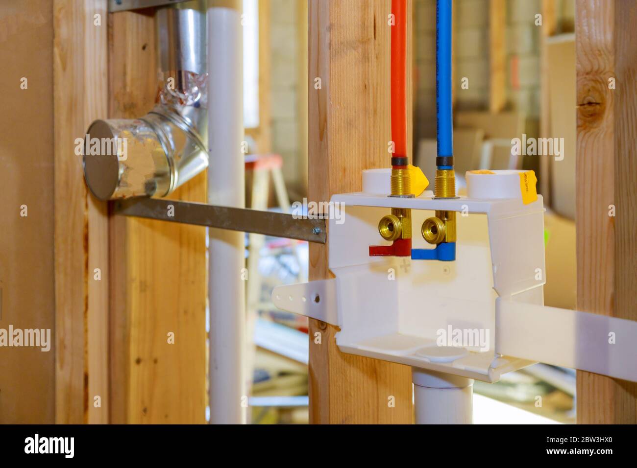 Interior framing of a plumbing outlet box for the laundry room in a new home under construction