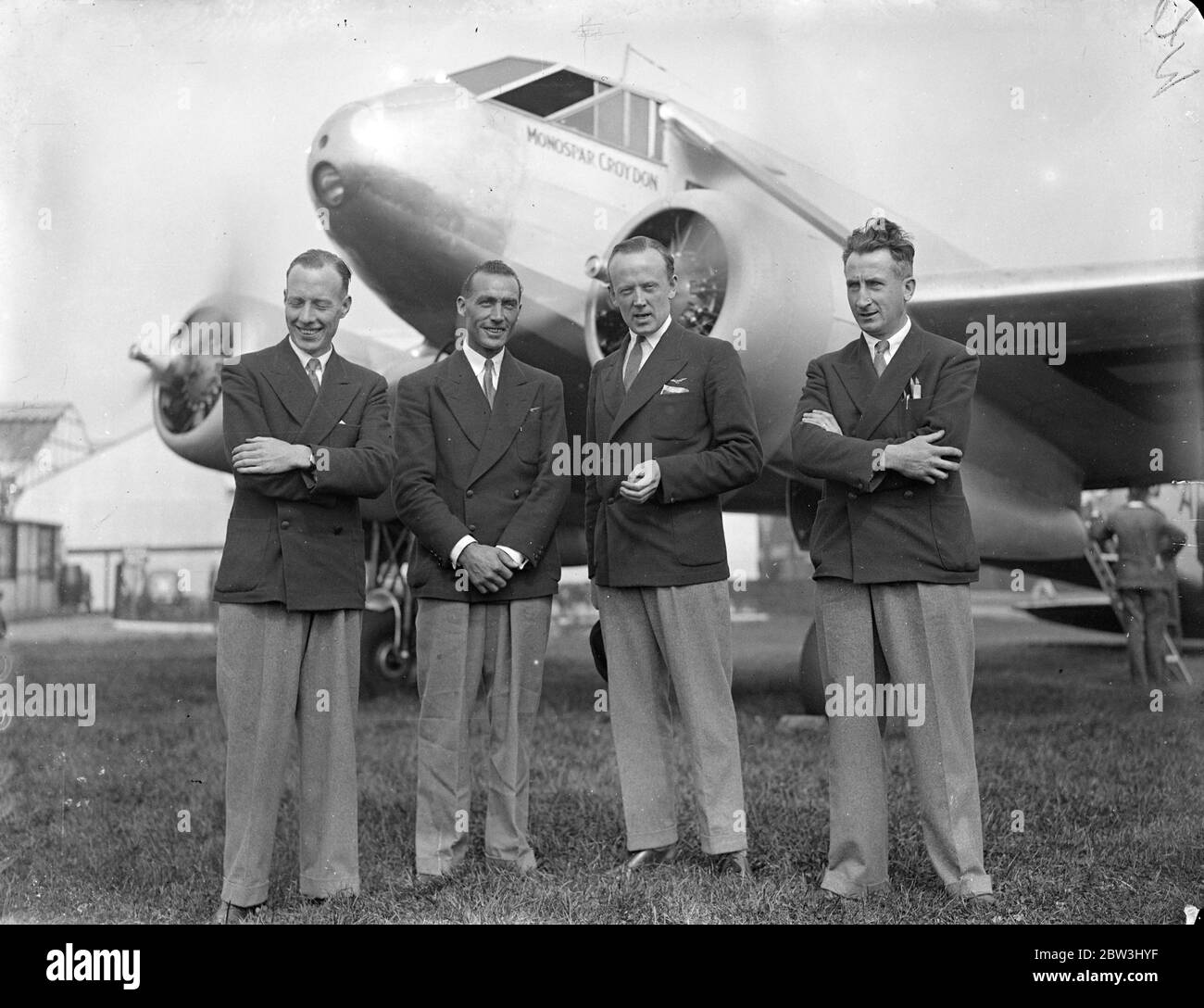 Lord Sempill leaves Hanworth on six day Australia and back attempt . Pioting a 200 mile an hour hour 18 seater Monospar plane , Lord Sempill , accompanied by a crew of three , left Hanworth Aerodrome on his second attempt to fly from England to Australia and back in six days . He hopes to cover the 12 , 000 miles to Melbourne in the record time of 70 flying hours . The first flight , which commenced earlier this month , was abandoned at Vienna owing to a defect in the auxiliery petrol supply . Photo shows , Lord Sempill ( second from right ) with Mr H Wood , co-pilot , Mr C P R , Gilroy , radi Stock Photo