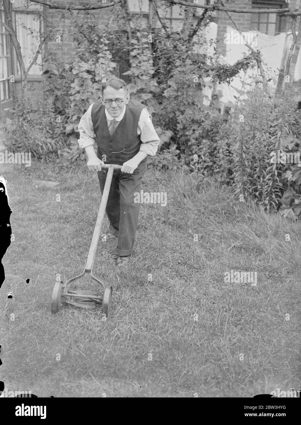 Back in an English Garden . Mr Rohme finds peace at London home after imprisonment in Germany . Tending his garden in the peace of surburban London , Mr Robert O Rohme is now recuperating at his home in Colindale from the effects of his 15 months imprisonment in Germany , where he was accusedof insulting Hitler . Mr Rohme says he ' suffered hell ' at the hands of the Nazi , who subjected him to virtual starvation , and is now attempting to regain the nearly four stones of weight he lost during his imprisonment . Photo shows , Mr Robert O Rohme digging in his garden at Colindale . 13 July 1936 Stock Photo