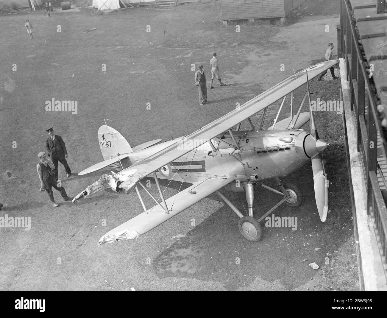A Hawker Fury 1 ( K 2067 ) of No 3 Flying Training School force landed at Grantham and ran into the pavilion damaging its starboad wings . 30 July 1936 Stock Photo