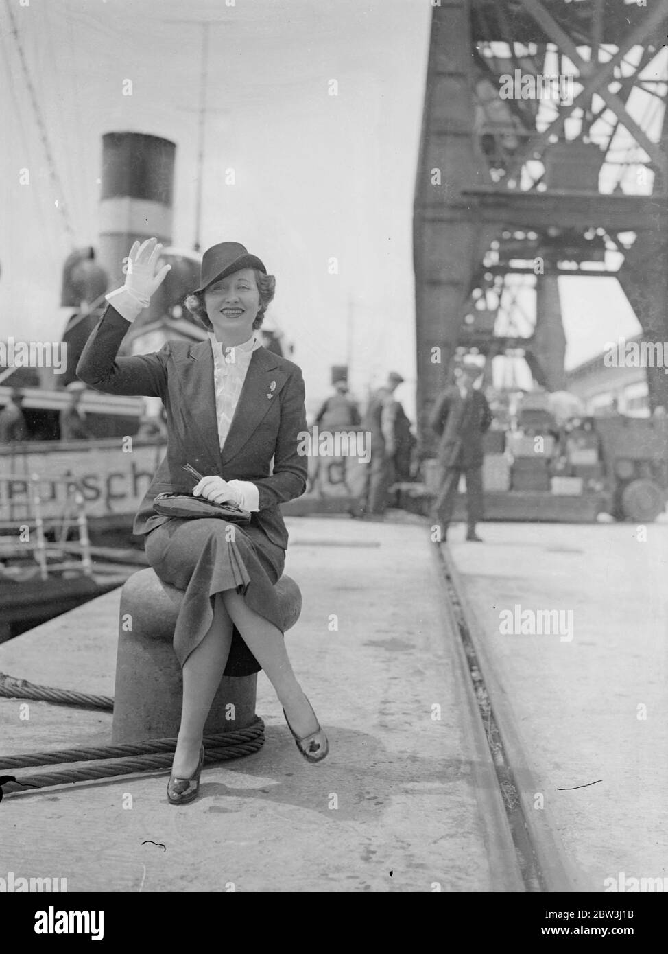 Genevieve Tobin arrives to make British film . Miss Genevieve Tobin , the American film actress , arrived at Southampton from New York aboard the liner Europa . She is to play opposite Edward Everett Horton in a British film to be made at Elstree . Photo shows , Genevieve Tobin waving on arrival at Southampton . 13 July 1936 Stock Photo