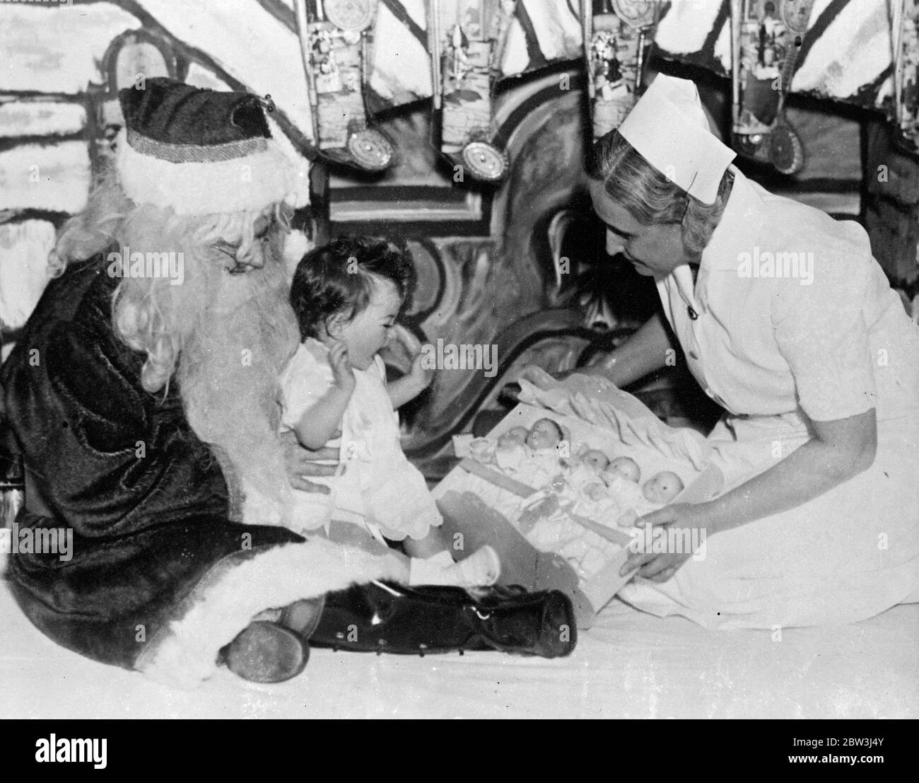 Exclusive pictures of the Dionne Quintuplets Christmas Party . Quin dolls for a Quin . Cecile 