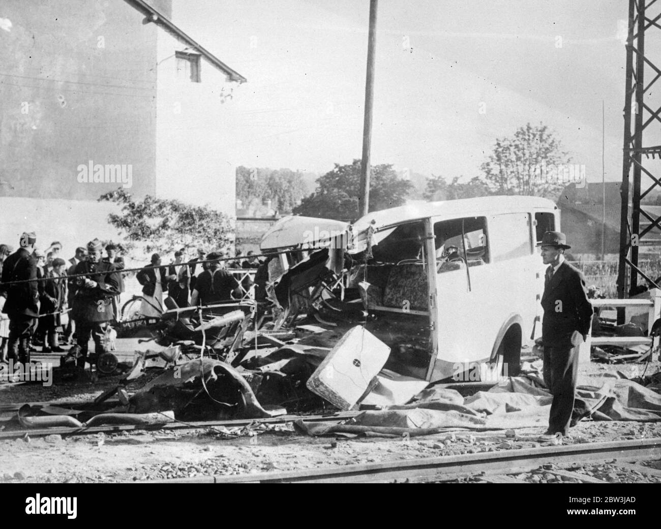 7 Killed, 19 Injured When Express Wrecks Excursion Coach Near Rouen . Seven people were killed and nineteen injured when a Paria - Cherbourg express crashed into the motor - coach which they were returning from a day - trip at a level crossing at Bernay ( Eure ) near Rouen . Part of the wreckage of the coach was carried over a quarter of mile along the track . Photo Shows : The wreckage of the motor - coach at the level crossing . 22 Jun 1936 Stock Photo