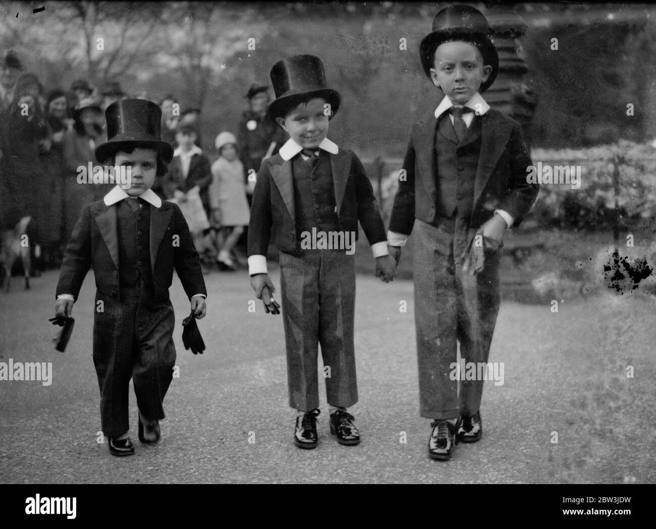 Little Meni in the park . Under the  fatherly  guidance of their  big brother  the small sons of Dr O Aguilar , Chancellors of the Venezuelan Legation in London stroll through the Park after Church . 13 October 1935 Stock Photo