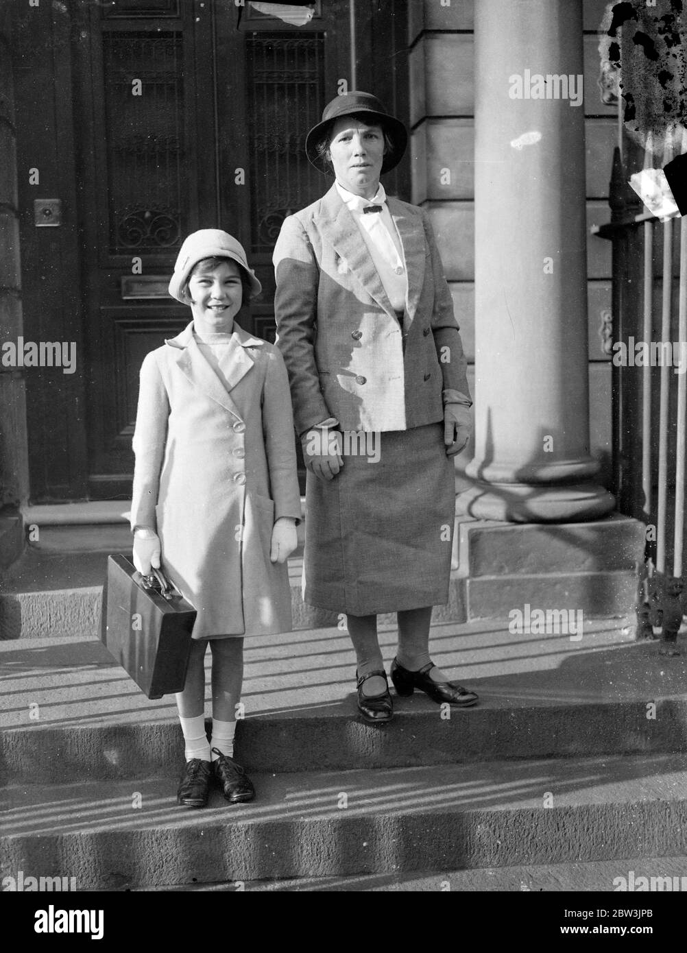 Seven year old bridesmaid for Lady Alice Scott 's wedding to Duke of Gloucester . Miss Ann Hawkins on the walk to school with her nurse . 1 October 1935 Stock Photo