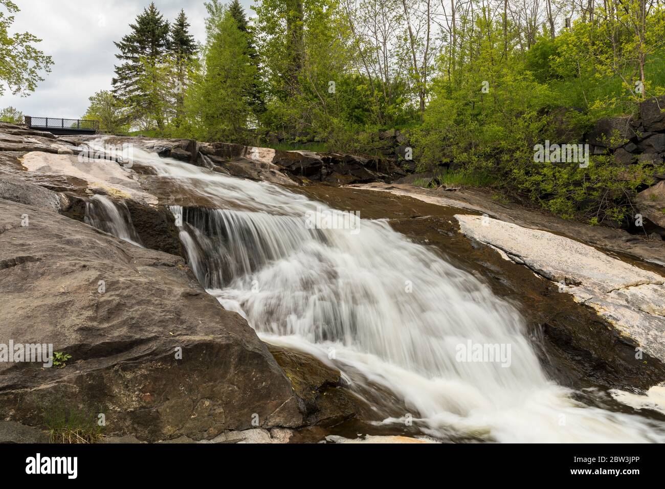 Miller Creek Waterfall with Footbridge Stock Photo Alamy