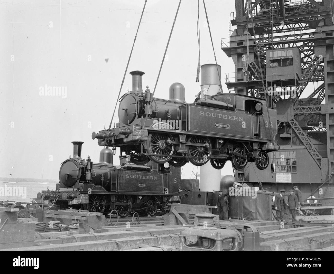 Loading two railways engines by the 150 ton floating crane for the Isle of Wight holiday rush . Southern Railway , trains . 1936 Stock Photo